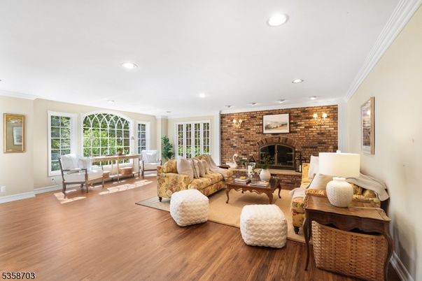 Fireplace, Interior, Living room, Recessed Lighting, Stone Walls, Wood Texture Flooring