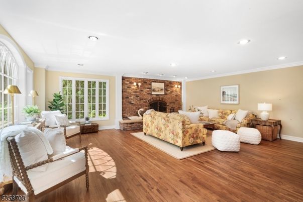 Fireplace, Interior, Living room, Recessed Lighting, Stone Walls, Wood Texture Flooring