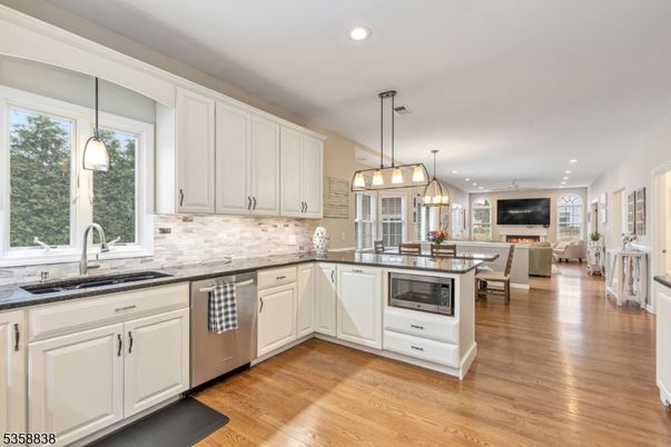 Dining room, Interior, Kitchen, Living room, Pendant Lights, Recessed Lighting, Stainless Steel Appliances, Wood Texture Flooring