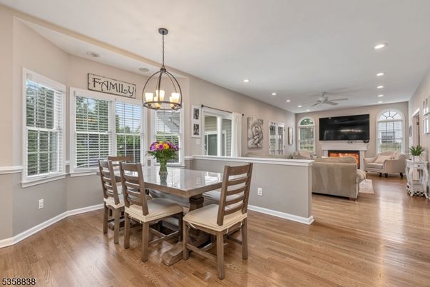 Dining room, Fireplace, Interior, Living room, Pendant Lights, Recessed Lighting, Wood Texture Flooring
