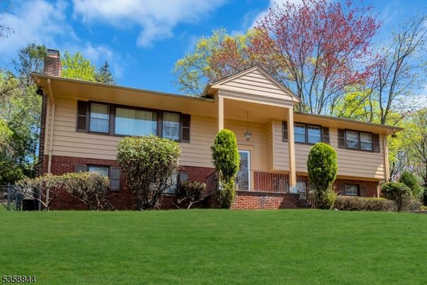 Backyard, Exterior, Facade, Brick Facade, Raised Ranch