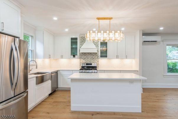 Chandelier, Interior, Kitchen, Pendant Lights, Recessed Lighting, Stainless Steel Appliances, Wood Texture Flooring