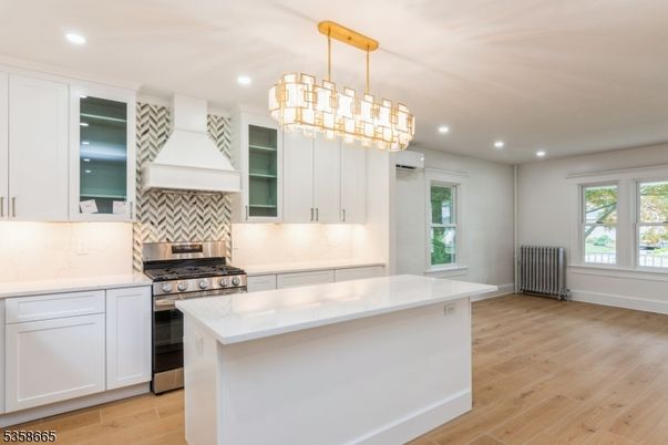 Chandelier, Interior, Kitchen, Pendant Lights, Recessed Lighting, Stainless Steel Appliances, Wood Texture Flooring