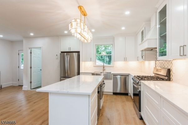 Chandelier, Interior, Kitchen, Recessed Lighting, Stainless Steel Appliances, Wood Texture Flooring