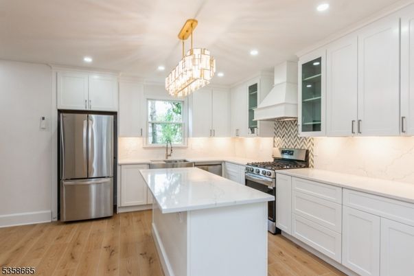Chandelier, Interior, Kitchen, Pendant Lights, Recessed Lighting, Stainless Steel Appliances, Wood Texture Flooring