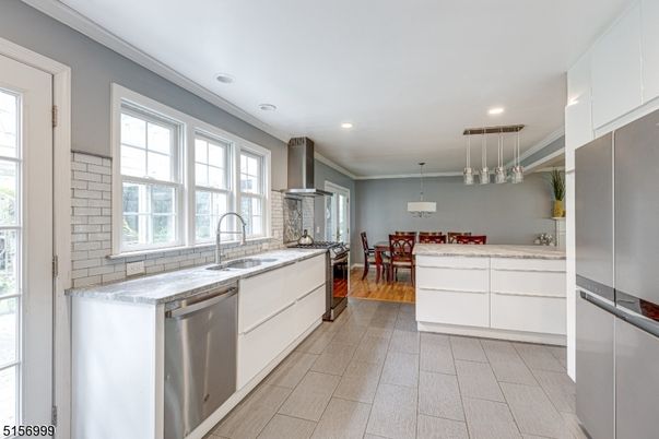 Dining room, Interior, Kitchen, Pendant Lights, Recessed Lighting, Stainless Steel Appliances, Wood Texture Flooring