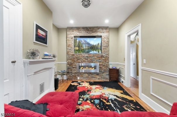 Fireplace, Interior, Recessed Lighting, Stone Walls, Wood Texture Flooring