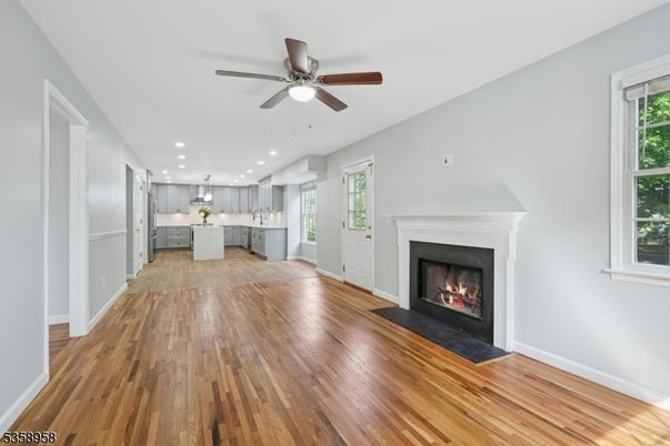 Empty room, Fireplace, Interior, Kitchen, Pendant Lights, Recessed Lighting, Wood Texture Flooring