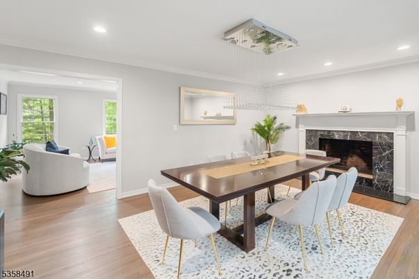 Dining room, Fireplace, Interior, Living room, Pendant Lights, Recessed Lighting, Wood Texture Flooring