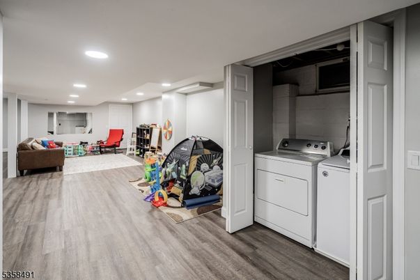 Interior, Living room, Recessed Lighting, Utility Closets, Washer, Wood Texture Flooring