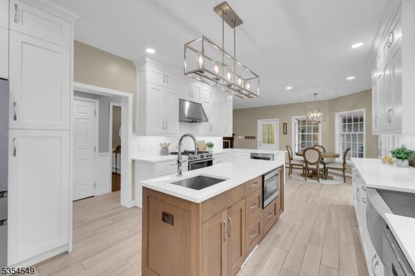 Chandelier, Dining room, Interior, Kitchen, Pendant Lights, Recessed Lighting, Stainless Steel Appliances, Wood Texture Flooring