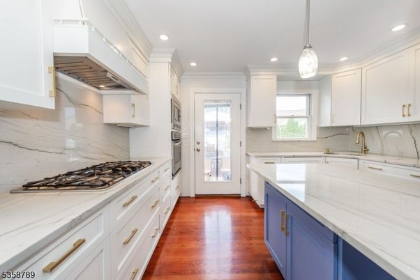 Interior, Kitchen, Marble Walls, Pendant Lights, Recessed Lighting, Wood Texture Flooring