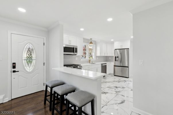 Interior, Kitchen, Marble, Pendant Lights, Recessed Lighting, Stainless Steel Appliances, Wood Texture Flooring