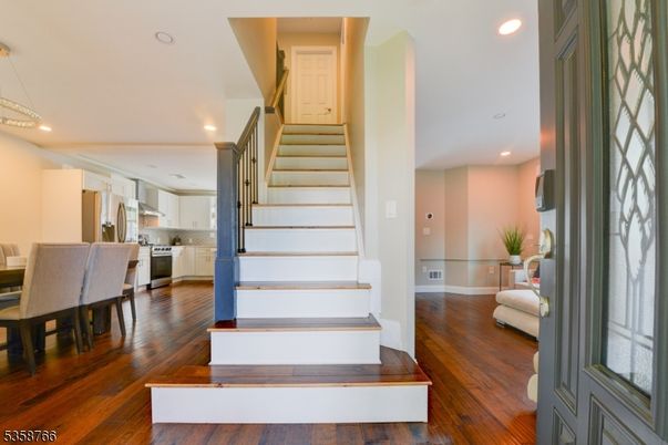 Dining room, Interior, Kitchen, Pendant Lights, Recessed Lighting, Stainless Steel Appliances, Wood Texture Flooring