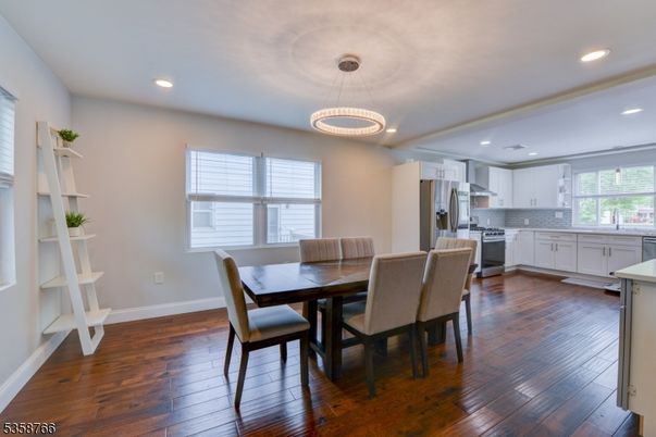 Dining room, Interior, Kitchen, Pendant Lights, Recessed Lighting, Stainless Steel Appliances, Wood Texture Flooring
