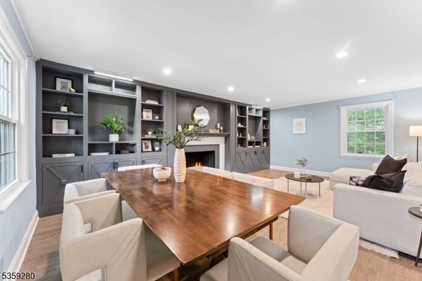 Dining room, Fireplace, Interior, Living room, Recessed Lighting, Wood Texture Flooring
