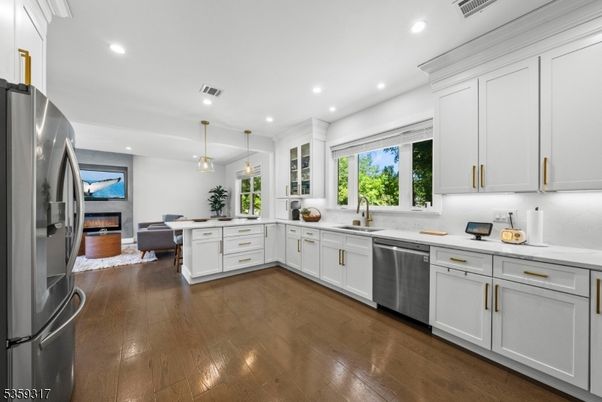 Fireplace, Interior, Kitchen, Pendant Lights, Recessed Lighting, Stainless Steel Appliances, Wood Texture Flooring