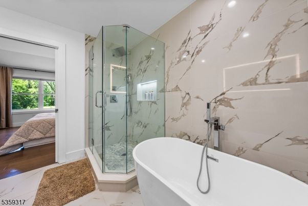 Bathroom, Free Standing Baths, Glass Shower, Interior, Marble, Marble Walls, Recessed Lighting, Wood Texture Flooring