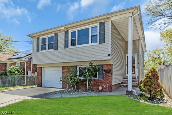 Attached, Exterior, Facade, Brick Facade, Solar Panels, Raised Ranch