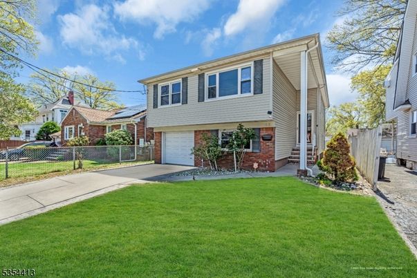 Attached, Exterior, Facade, Brick Facade, Solar Panels, Raised Ranch