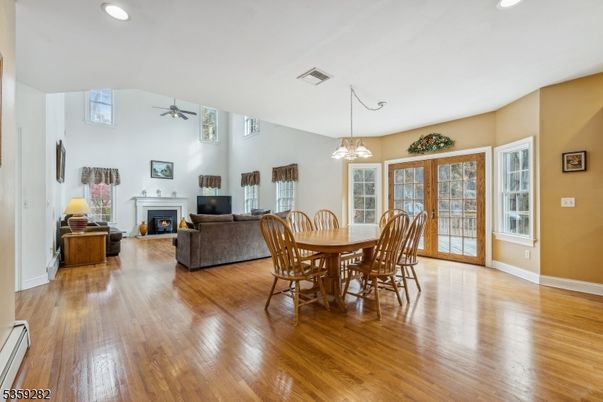 Dining room, Fireplace, Interior, Living room, Pendant Lights, Recessed Lighting, Wood Texture Flooring