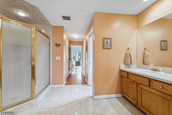 Bathroom, Dual Sink Vanities, Glass Shower, Interior, Recessed Lighting, Wood Texture Flooring