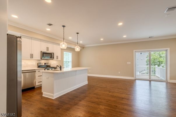 Interior, Kitchen, Pendant Lights, Recessed Lighting, Stainless Steel Appliances, Wood Texture Flooring