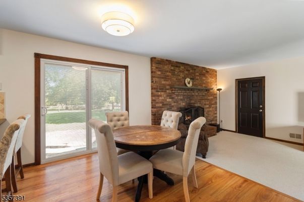 Dining room, Fireplace, Interior, Stone Walls, Wood Texture Flooring