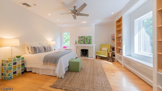 Bedroom, Fireplace, Interior, Recessed Lighting, Wood Texture Flooring