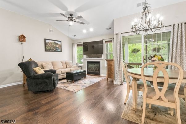 Chandelier, Dining room, Fireplace, Interior, Living room, Recessed Lighting, Wood Texture Flooring