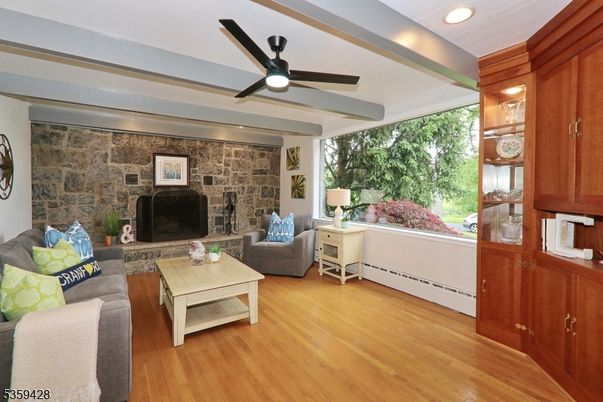 Fireplace, Interior, Living room, Recessed Lighting, Stone Walls, Wood Texture Flooring
