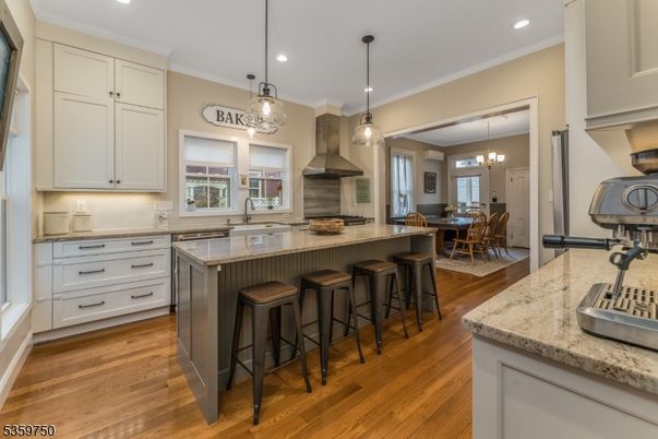 Chandelier, Dining room, Interior, Kitchen, Pendant Lights, Recessed Lighting, Stainless Steel Appliances, Wood Texture Flooring