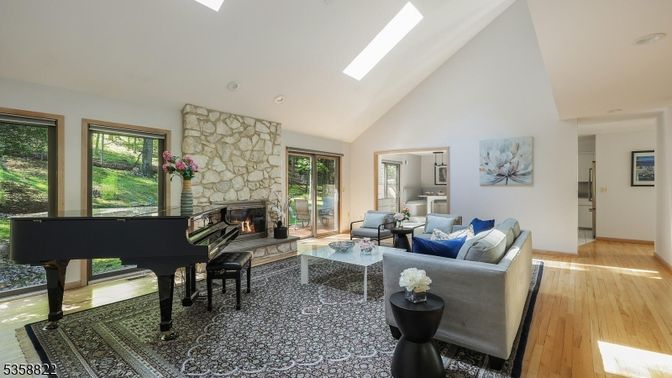 Fireplace, Interior, Living room, Piano, Recessed Lighting, Stone Walls, Wood Texture Flooring