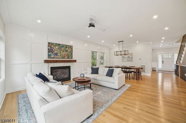 Dining room, Fireplace, Interior, Living room, Pendant Lights, Recessed Lighting, Wood Texture Flooring