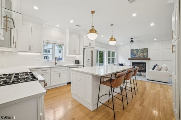 Fireplace, Interior, Kitchen, Living room, Pendant Lights, Recessed Lighting, Wood Texture Flooring