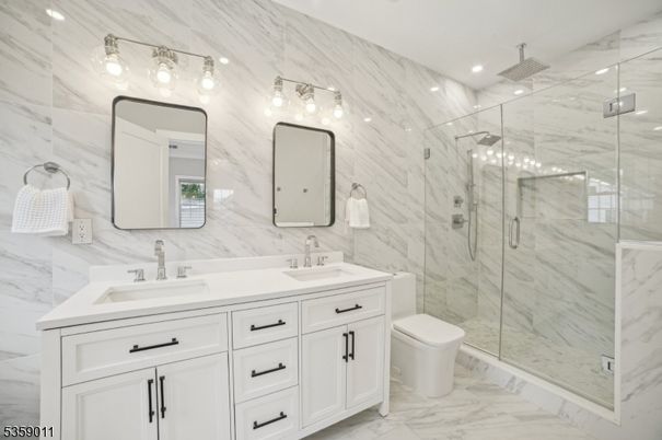 Bathroom, Dual Sink Vanities, Glass Shower, Interior, Marble, Marble Walls, Recessed Lighting