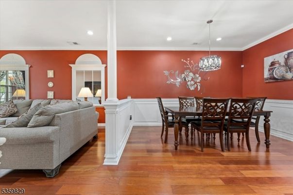 Chandelier, Dining room, Fireplace, Interior, Living room, Pendant Lights, Recessed Lighting, Wood Texture Flooring