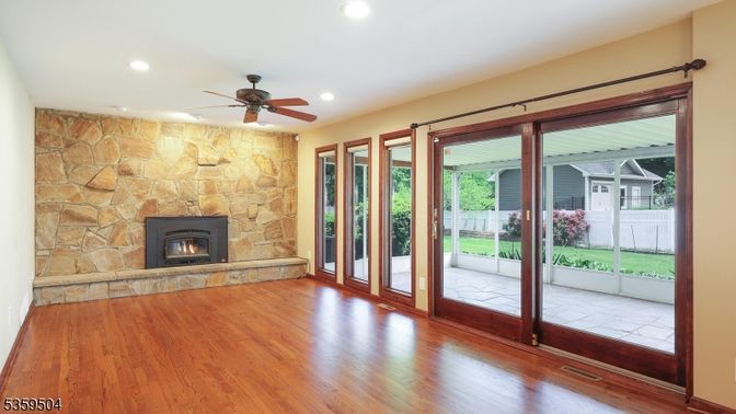 Empty room, Fireplace, Interior, Recessed Lighting, Stone Walls, Wood Texture Flooring
