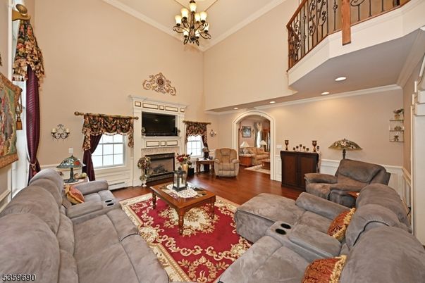 Chandelier, Fireplace, Interior, Living room, Recessed Lighting, Wood Texture Flooring