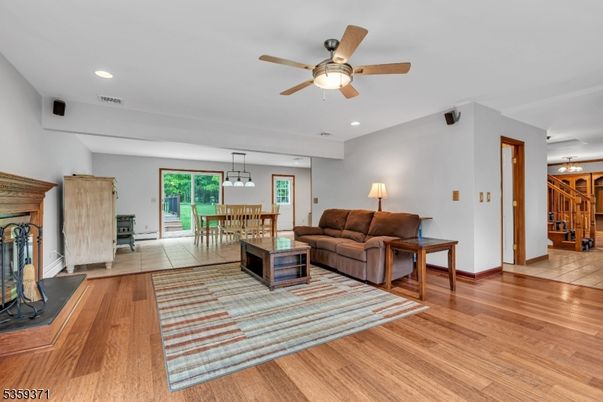 Dining room, Fireplace, Interior, Living room, Pendant Lights, Recessed Lighting, Wood Texture Flooring