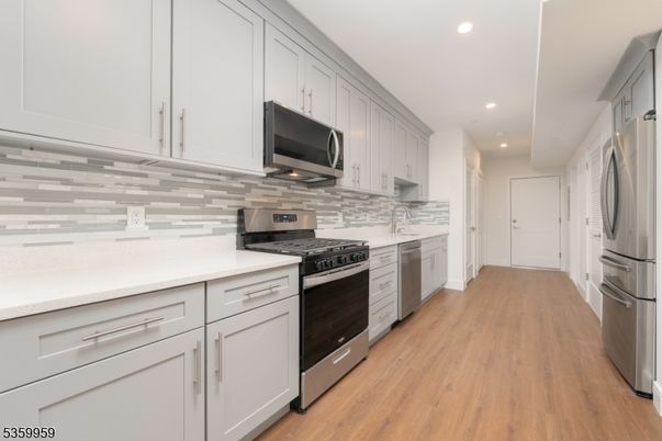 Interior, Kitchen, Recessed Lighting, Stainless Steel Appliances, Wood Texture Flooring