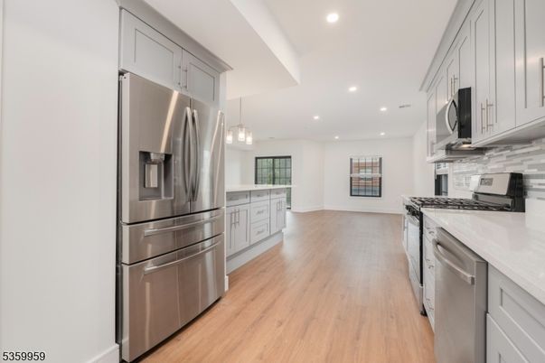 Interior, Kitchen, Pendant Lights, Recessed Lighting, Stainless Steel Appliances, Wood Texture Flooring
