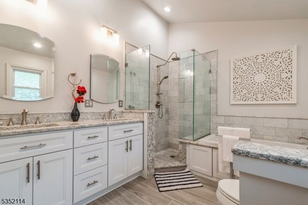 Bathroom, Dual Sink Vanities, Glass Shower, Interior, Recessed Lighting, Wood Texture Flooring