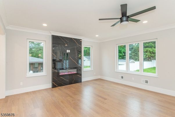 Empty room, Fireplace, Interior, Marble Walls, Recessed Lighting, Wood Texture Flooring