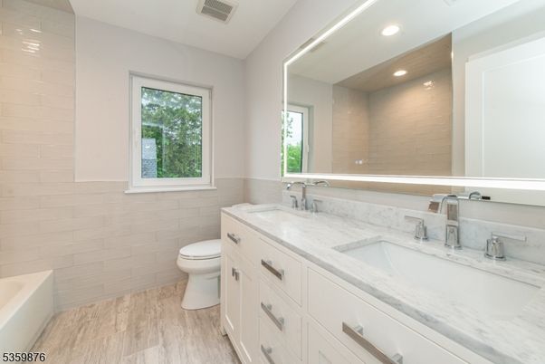 Bathroom, Dual Sink Vanities, Interior, Recessed Lighting, Wood Texture Flooring