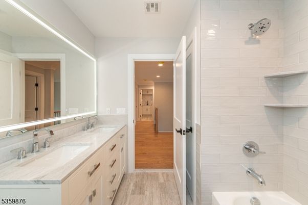 Bathroom, Dual Sink Vanities, Interior, Recessed Lighting, Wood Texture Flooring