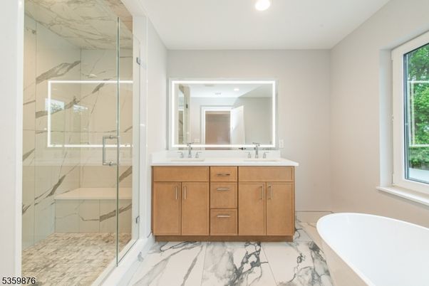 Bathroom, Dual Sink Vanities, Glass Shower, Interior, Marble, Marble Walls, Recessed Lighting
