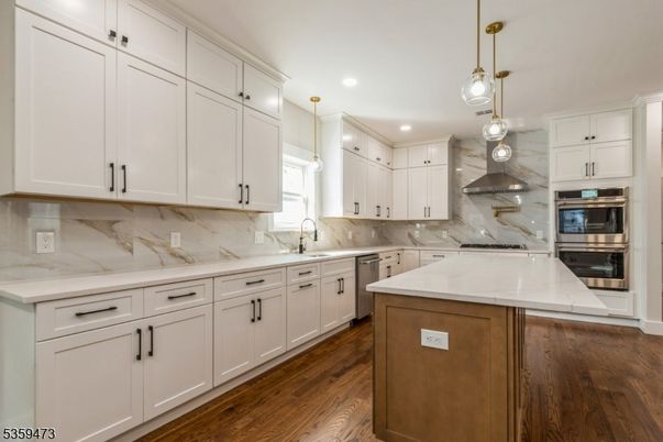 Interior, Kitchen, Marble Walls, Pendant Lights, Recessed Lighting, Stainless Steel Appliances, Wood Texture Flooring