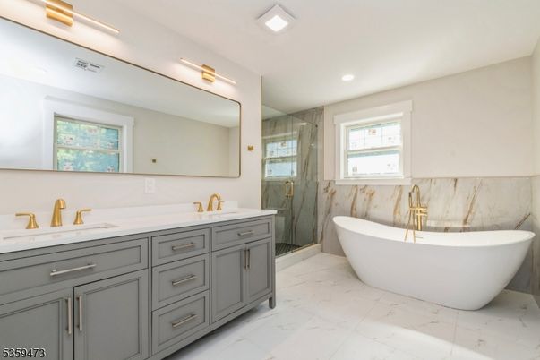 Bathroom, Dual Sink Vanities, Free Standing Baths, Glass Shower, Interior, Marble, Marble Walls, Recessed Lighting