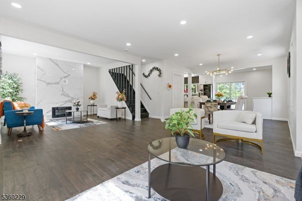 Chandelier, Dining room, Fireplace, Interior, Living room, Marble Walls, Pendant Lights, Recessed Lighting, Wood Texture Flooring